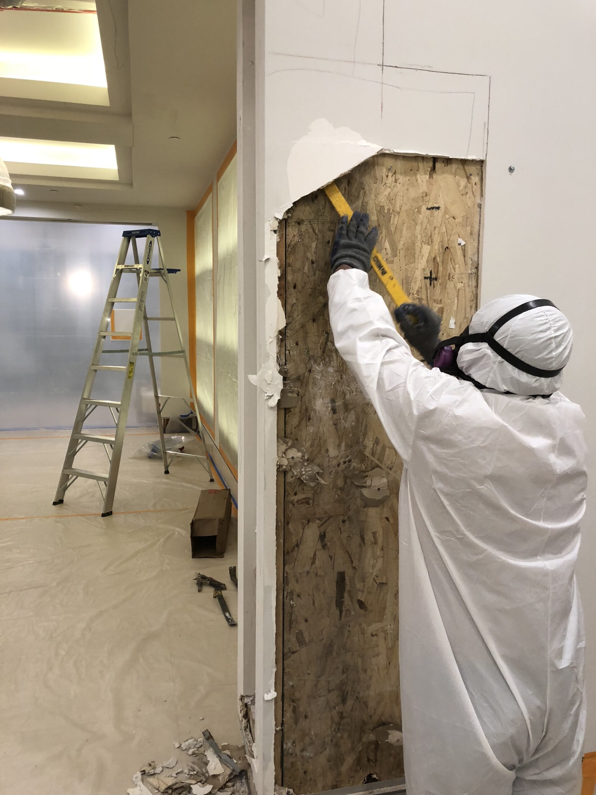 IMG_1727 Mold removal specialists from Orange County removing damaged drywall.